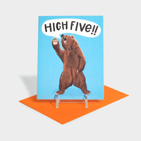 Greeting card with a bear waving its paw.