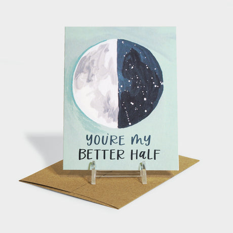 Greeting card with moon motif. Moon is split into dark and light halves.