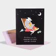 Birthday card with illustration of a possum eating pizza out of a pizza box.