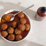 Meatballs with Curry Sriracha sauce. Photo © Bushwick Kitchen