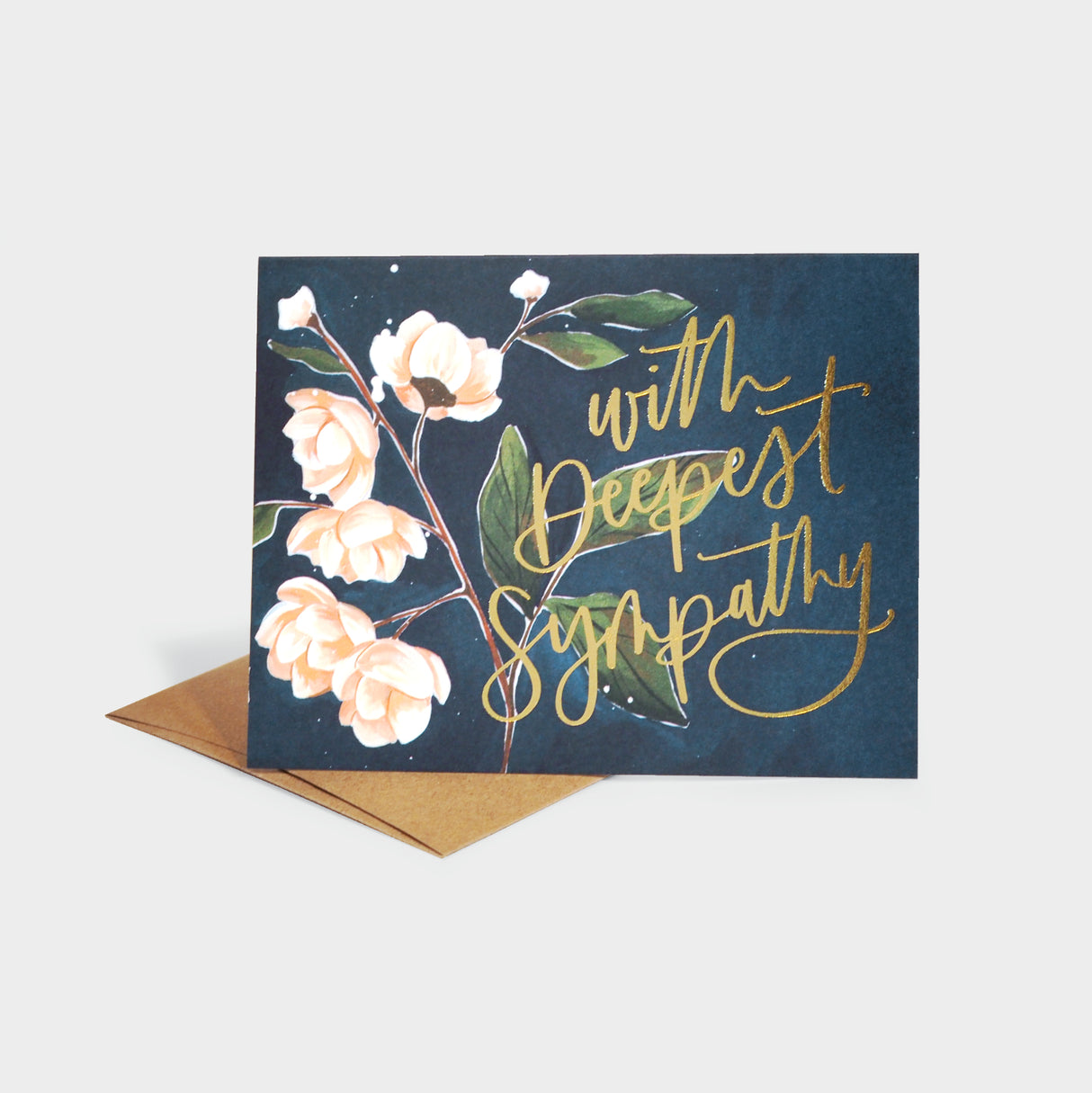 Greeting card with floral motif over a dark background and gold foil-stamped lettering.