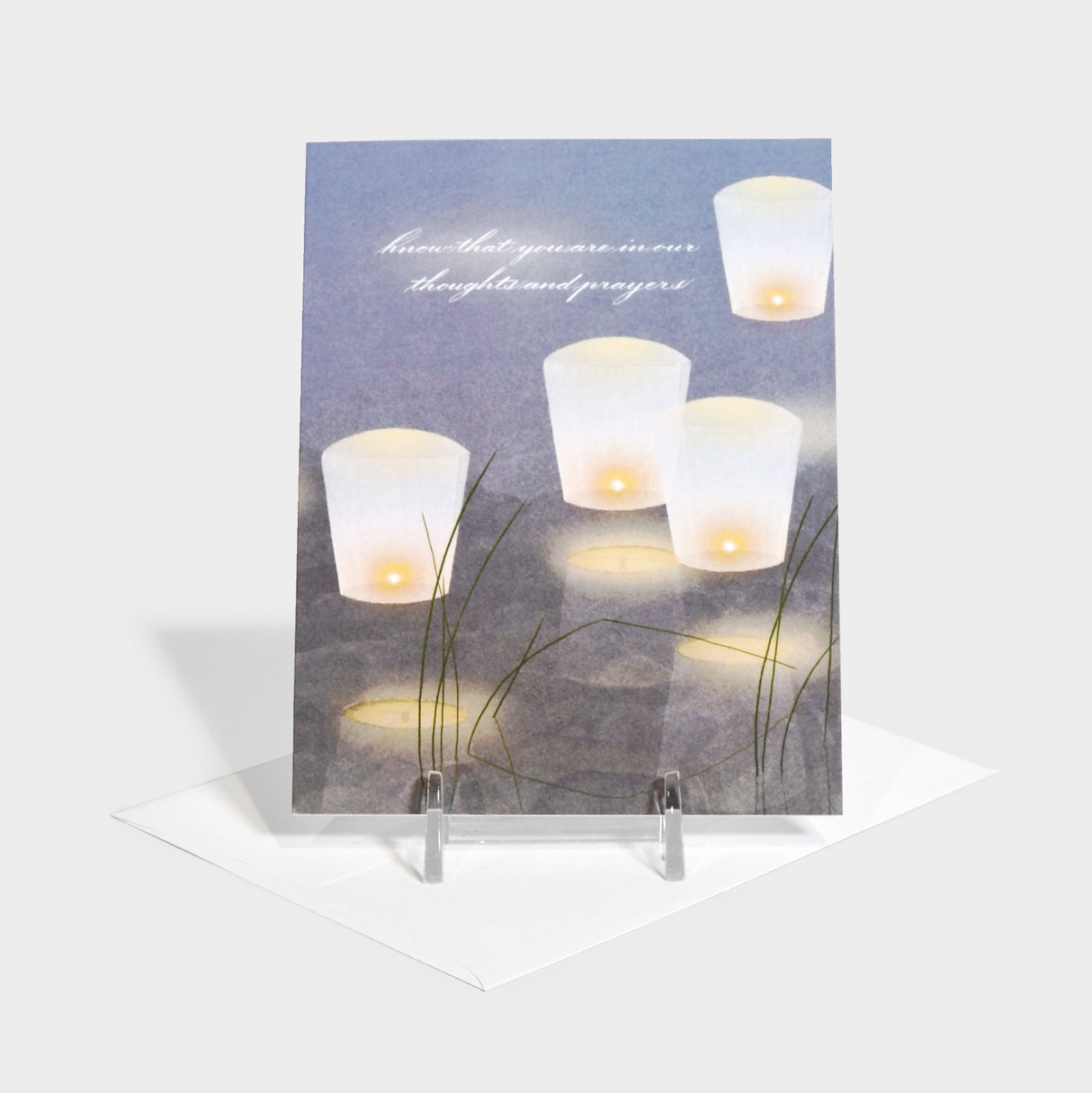 Greeting card with illustration of lanterns floating in water.