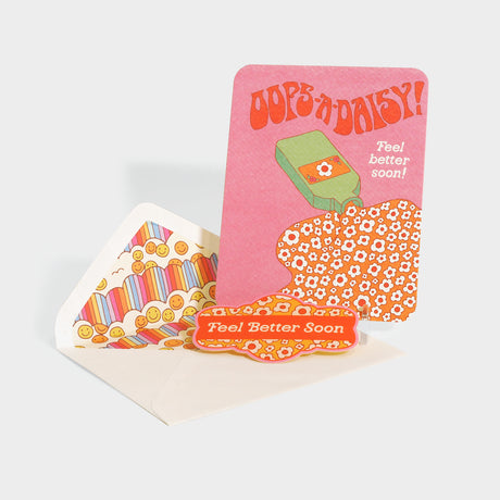 Greeting card with die-cut sealing sticker. Features a retro style illustration of a tipped over bottle that spills flowers.