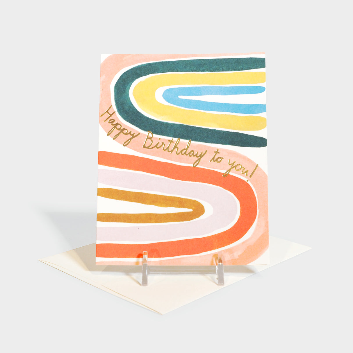 Greeting card with watercolor rainbow illustration and foil-stamped text.