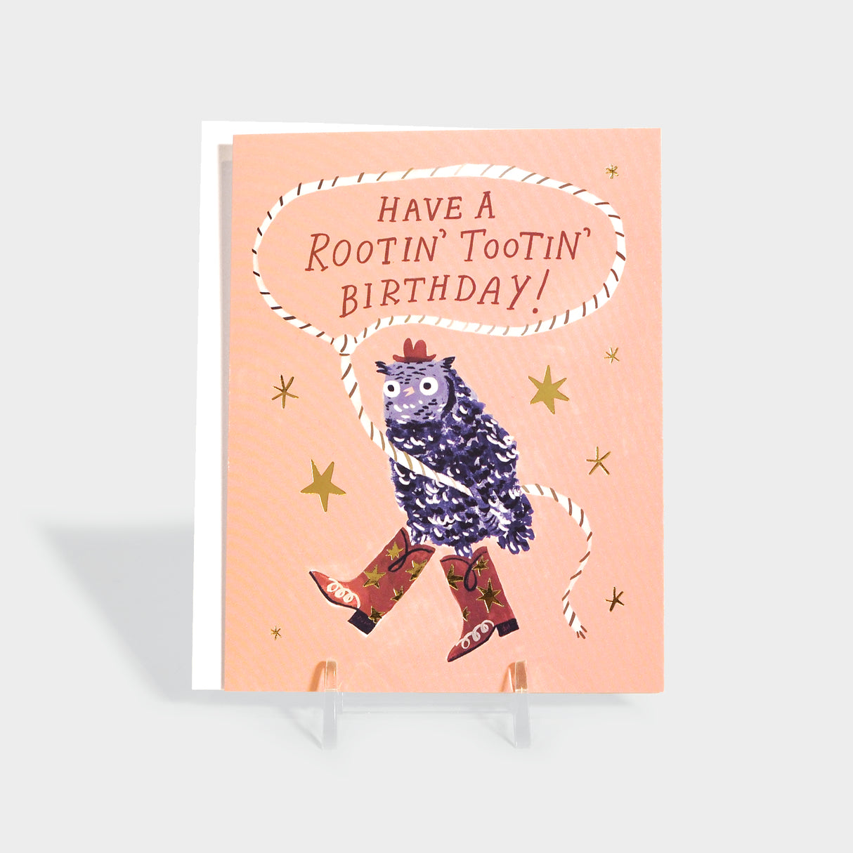 Greeting card of an owl dressed up as a cowboy. Featured gold foil-stamped details.