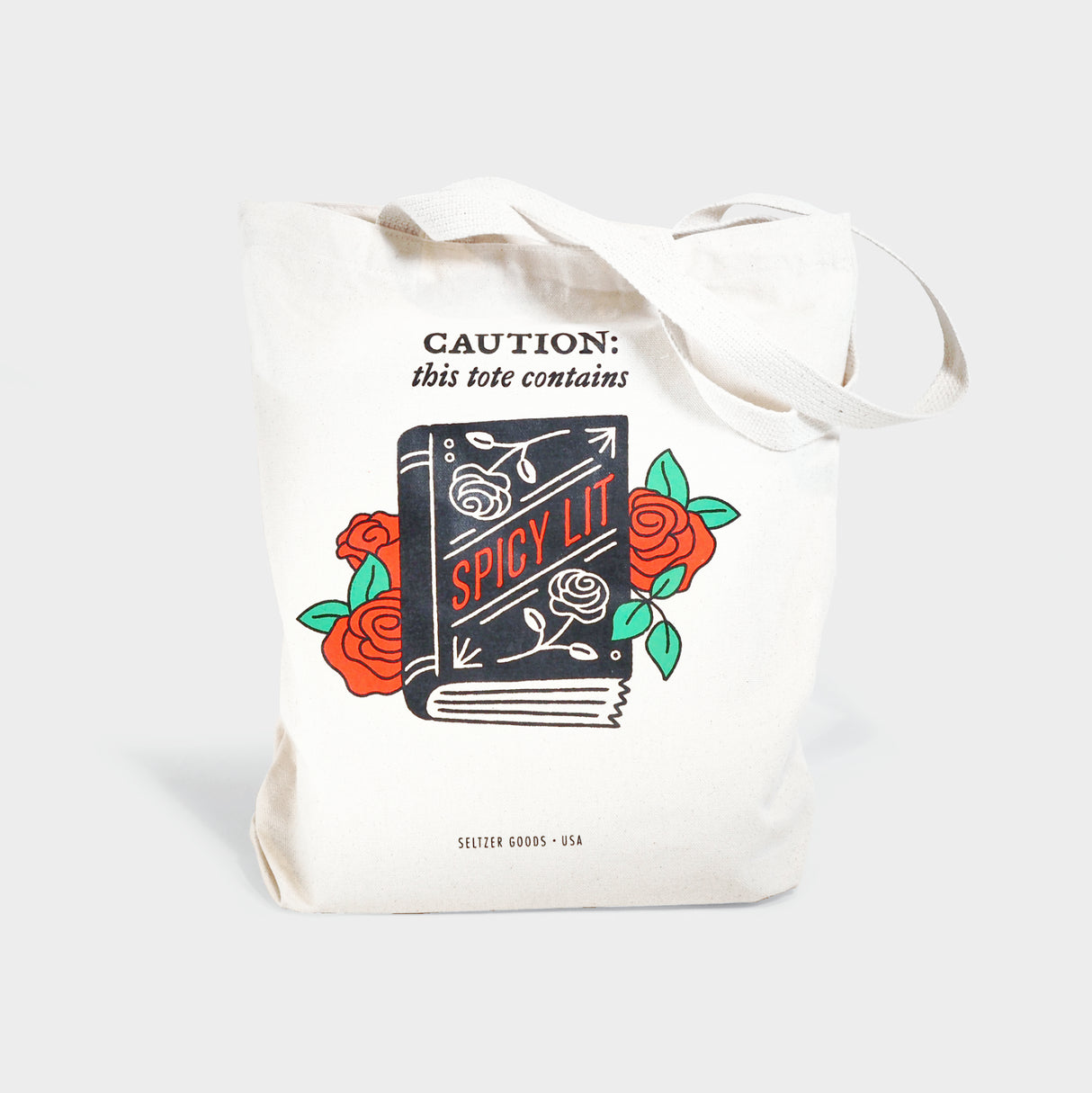 Tote bag with book and roses motif. Reads, "Caution: this tote contains SPICY LIT."