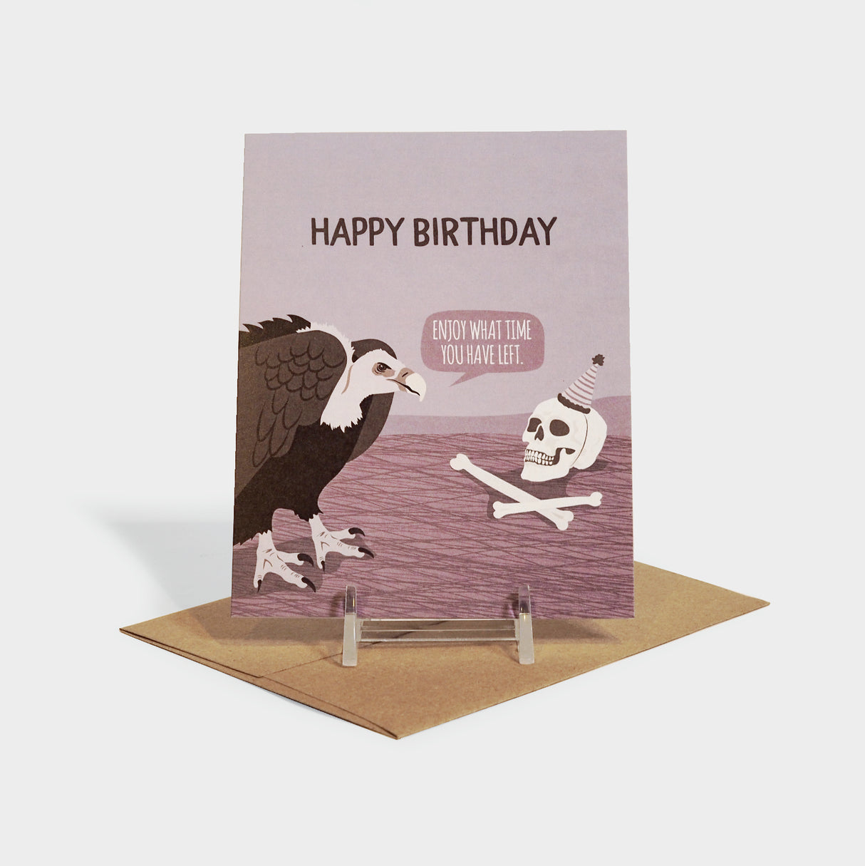 Greeting card with illustration of a vulture talking to a skull with a party hat.