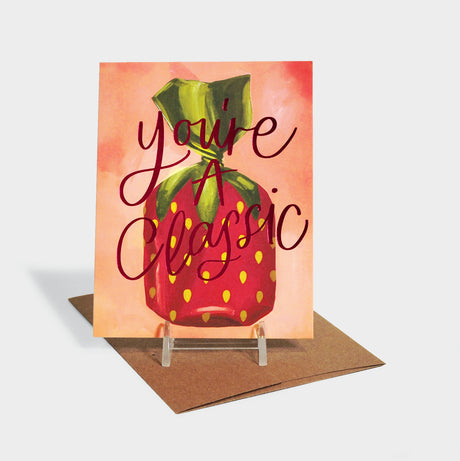 Greeting card with strawberry candy motif and red foil-stamped typography.